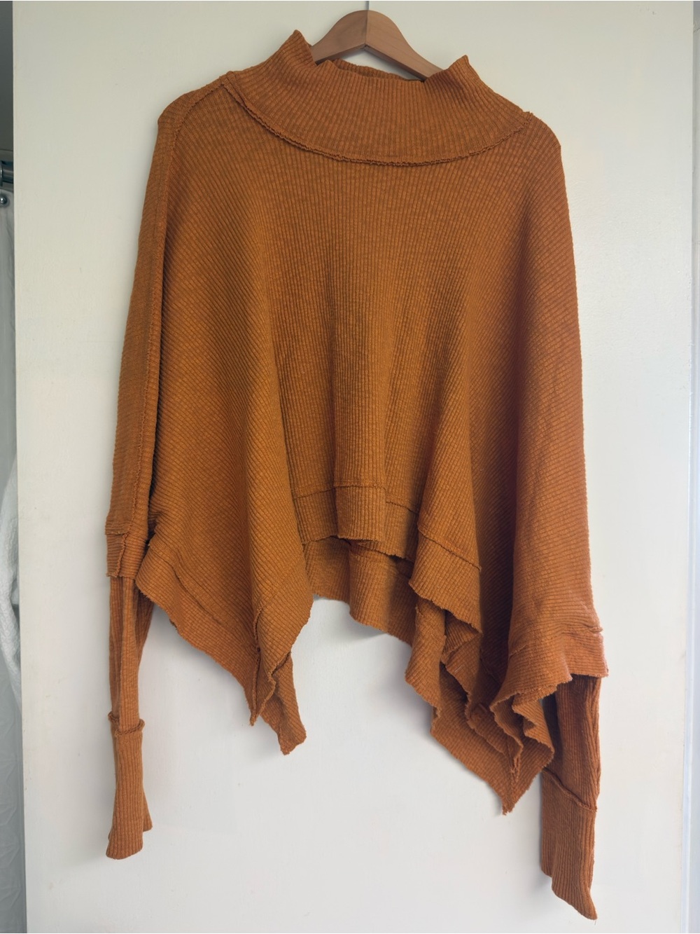 Free People rust orange draped poncho-style knit shrug